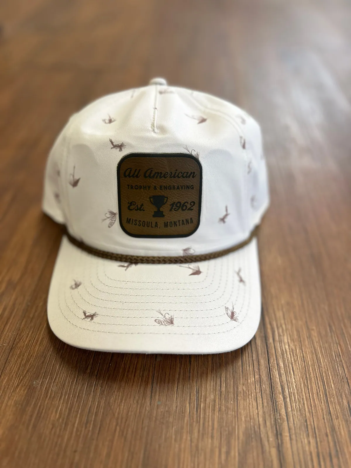 Hat Patch, Brown leather with black text